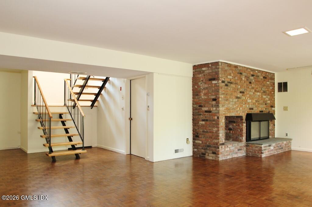 69 Studio Road Stamford, CT 06903 - Photo 25 of 35 Walkout LL Great room has fpl