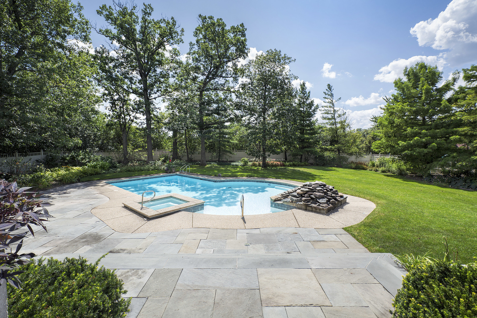 1115 Voltz Road Northbrook, IL 60062 - Photo 24 of 28 a view of backyard with seating space and trees in the background