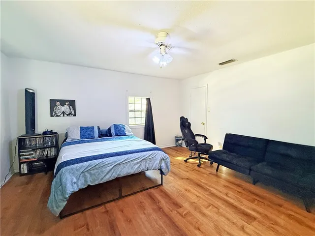 a bed room with a bed and a couch