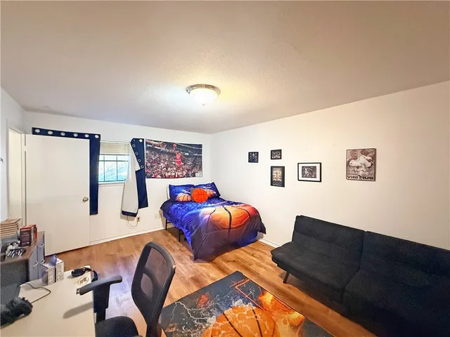 a living room with furniture and wall painting