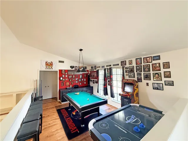 a living room with furniture a rug and a window
