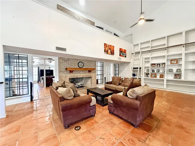 a living room with furniture and a fireplace
