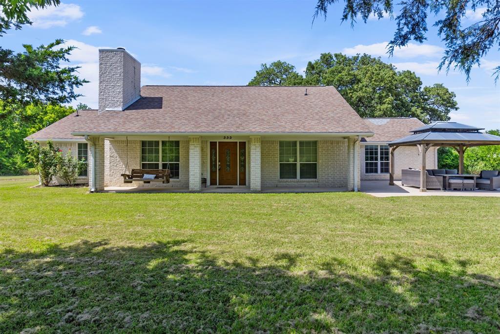 555 Rs County Road 4510 Point, TX 75472 - Photo 1 of 1 a front view of a house with a garden