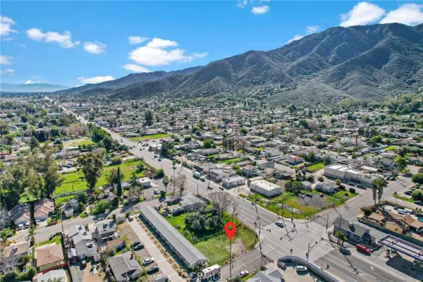 an aerial view of residential houses with outdoor space