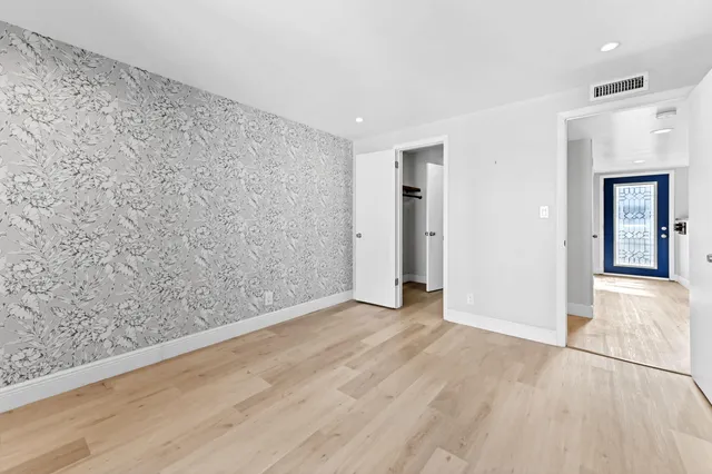 wooden floor in a hall with an entryway