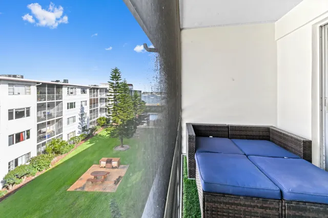 a view of balcony with yard