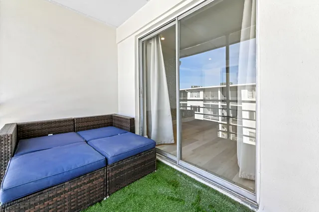 a room with pool table and windows