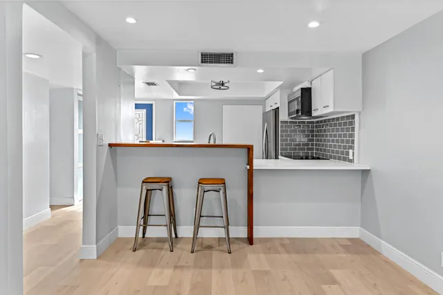 a view of kitchen with furniture and window