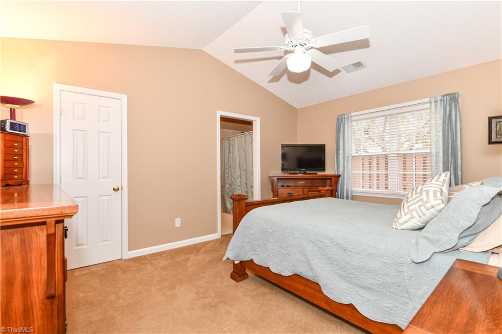 4406 Single Tree Lane High Point, NC 27265 - Photo 12 of 23 Master bedroom with walkin closet and access to it's own bathroom.