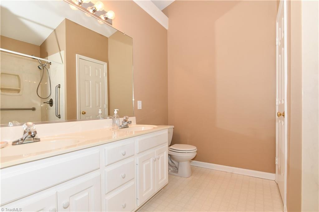 4406 Single Tree Lane High Point, NC 27265 - Photo 14 of 23 Master bathroom with double vanities.