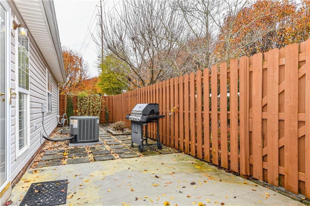 4406 Single Tree Lane High Point, NC 27265 - Photo 21 of 23 Back patio with privacy fence