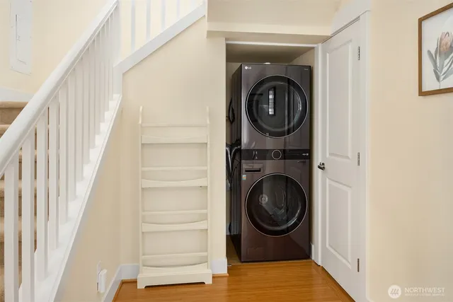 a view of a hallway with washer and dryer