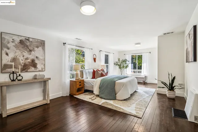 a en suite bathroom with a granite countertop sink and a mirror