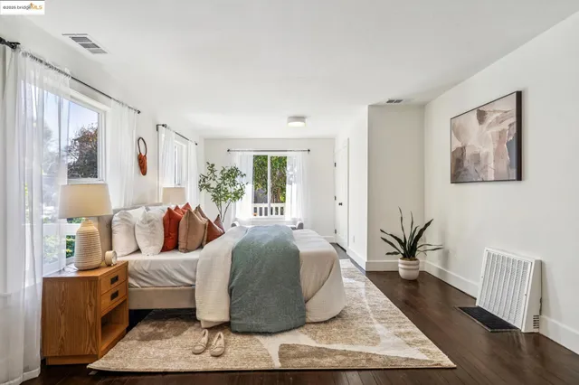 a bedroom with a bed and a table in it