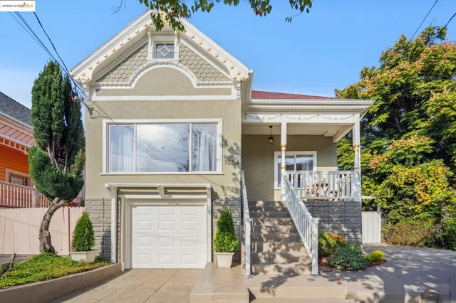 a living room with furniture a chandelier and a floor to ceiling window