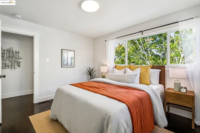 a bedroom with bed and a closet