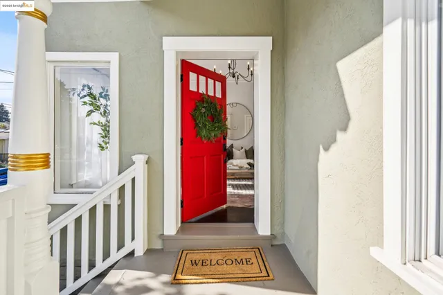 a living room with fireplace furniture and a large window