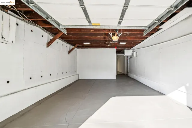 a view of a patio with couches table and chairs and potted plants