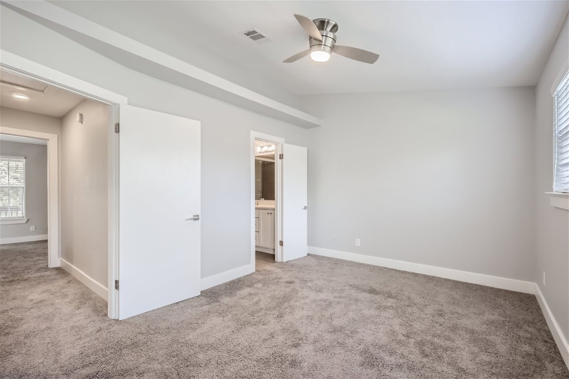 1830 River Crossing Circle, Unit D Austin, TX 78741 - Photo 11 of 27 a view of an empty room with a window