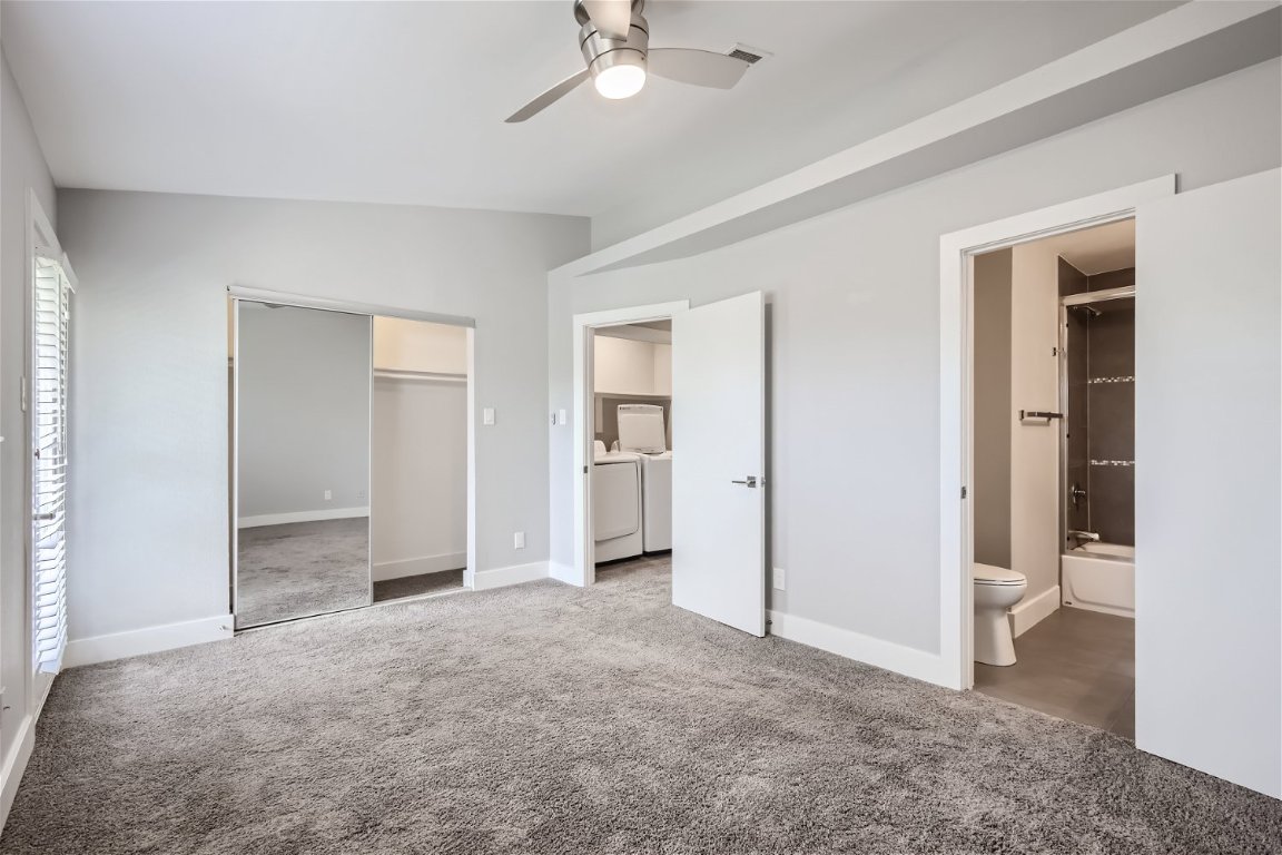 1830 River Crossing Circle, Unit D Austin, TX 78741 - Photo 12 of 27 a view of empty room with a ceiling fan