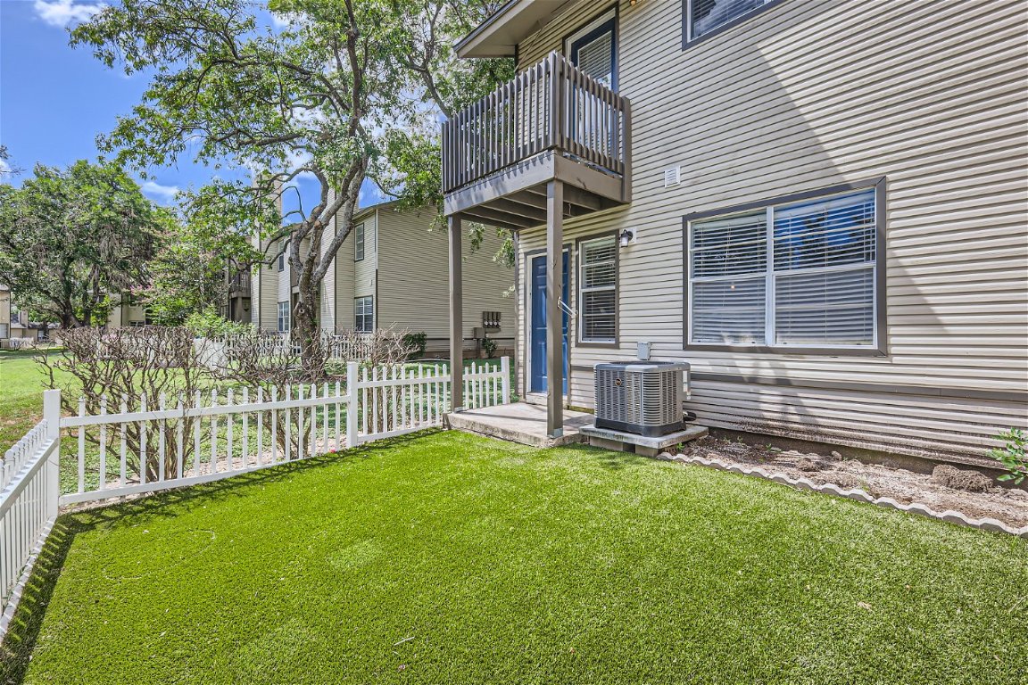 1830 River Crossing Circle, Unit D Austin, TX 78741 - Photo 24 of 27 a view of a house with a yard and sitting area