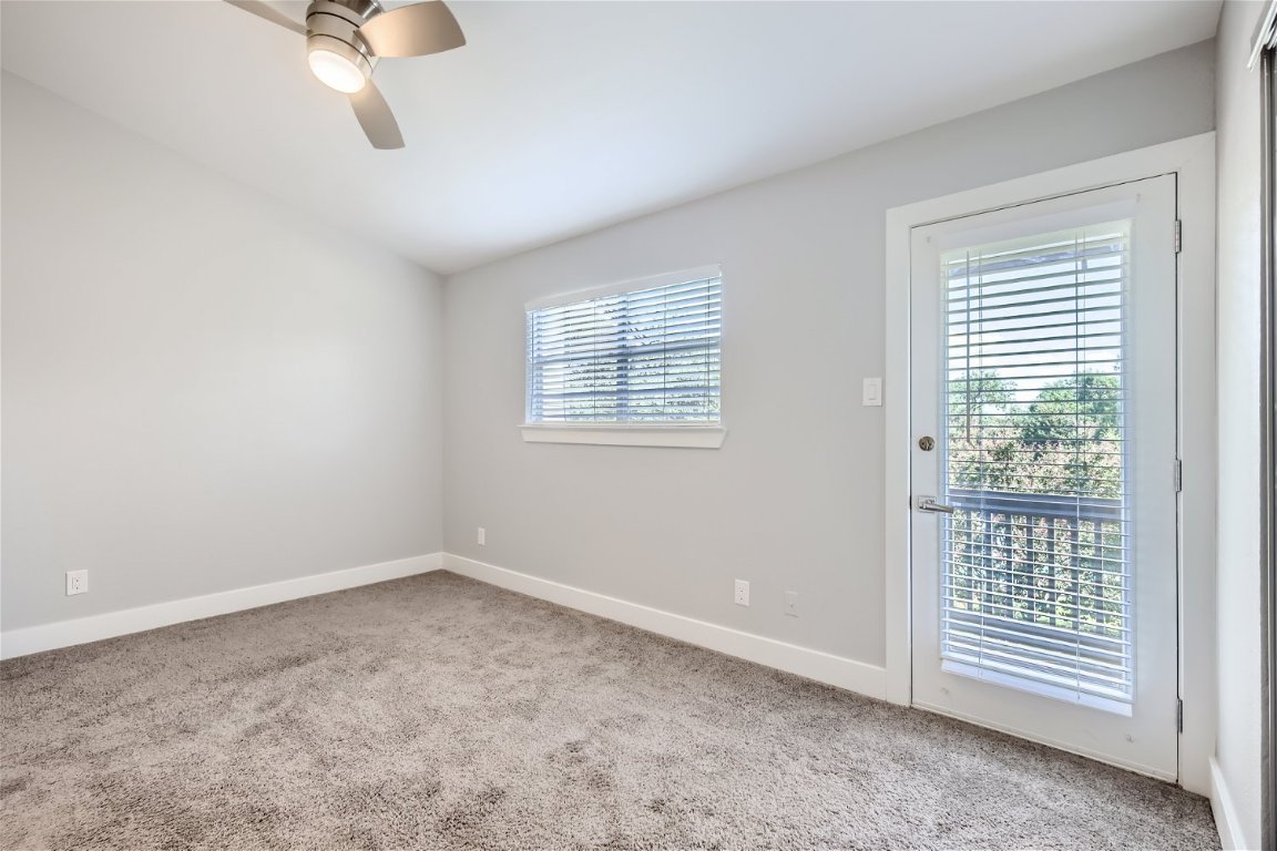 1830 River Crossing Circle, Unit D Austin, TX 78741 - Photo 10 of 27 a view of an empty room with a window
