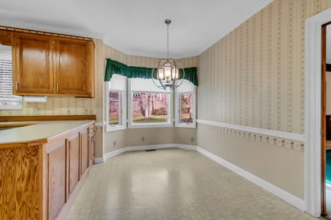 a view of a kitchen with a sink and dishwasher cabinet