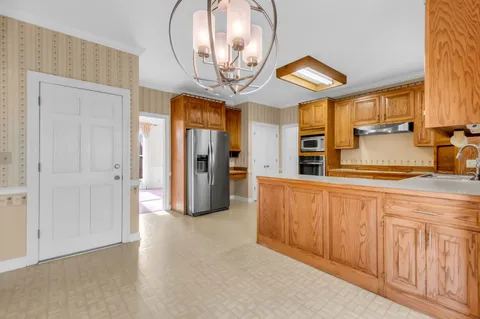 an entryway with a livingroom and a wooden floor