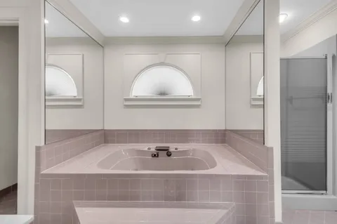 a bathroom with a bathtub and a sink