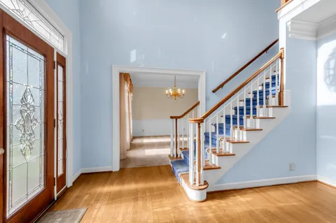 a view of entryway with wooden floor