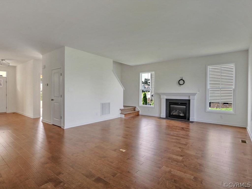 14990 B River Road Chesterfield, VA 23838 - Photo 9 of 19 a view of empty room with fireplace and wooden floor