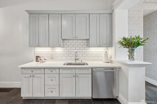 a kitchen with a sink and cabinets