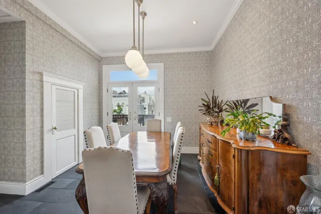 a view of a dining room with furniture wooden floor and chandelier