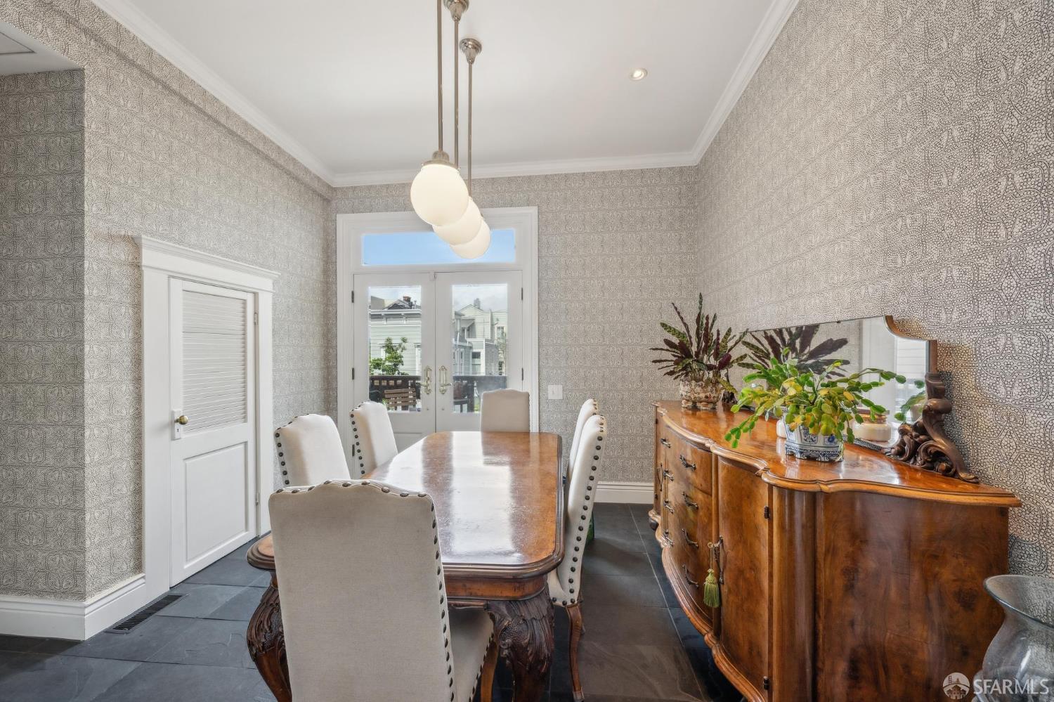 276 Page Street San Francisco, CA 94102 - Photo 18 of 25 a view of a dining room with furniture wooden floor and chandelier