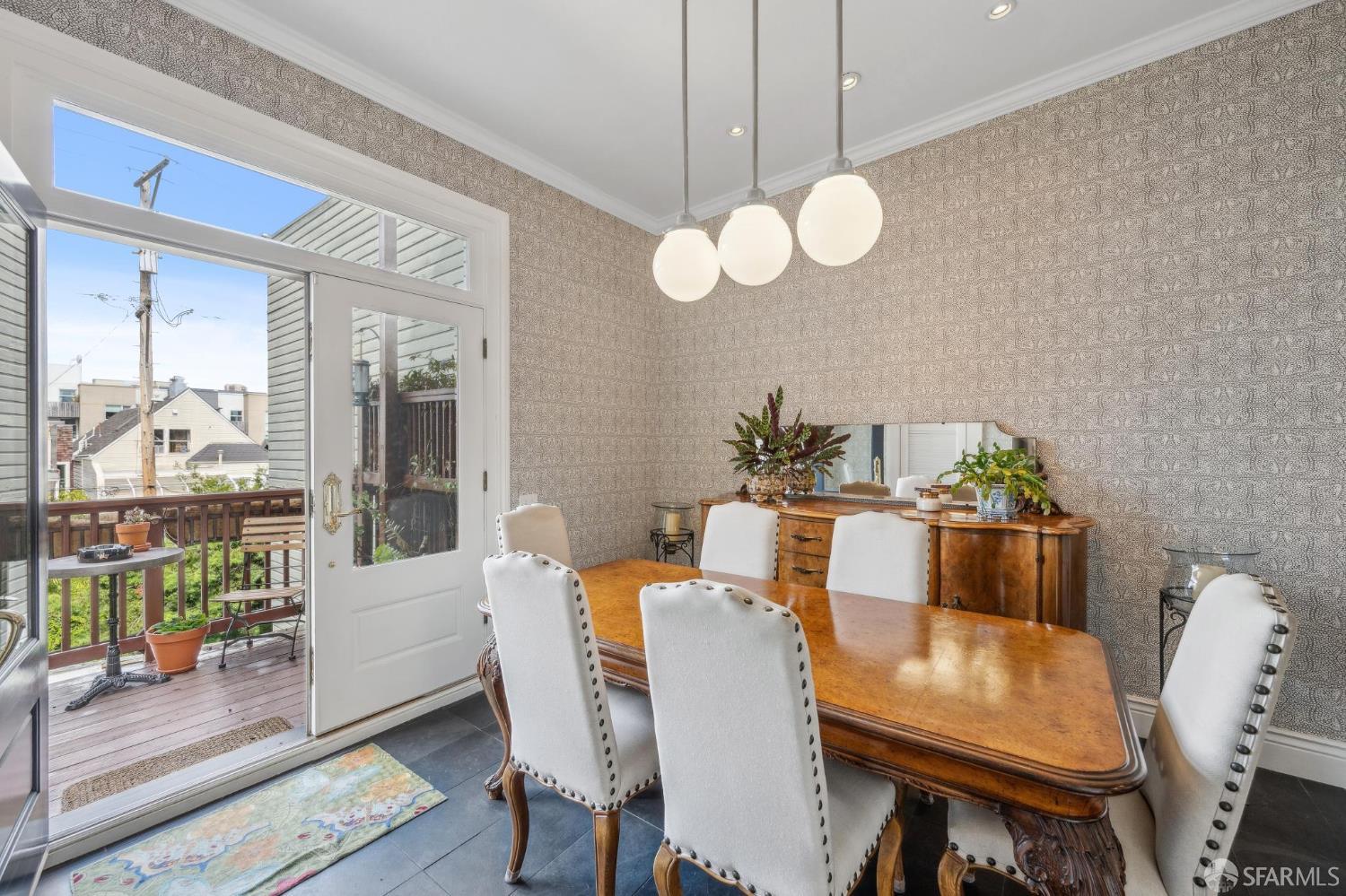 276 Page Street San Francisco, CA 94102 - Photo 19 of 25 a view of a dining room with furniture wooden floor and a rug
