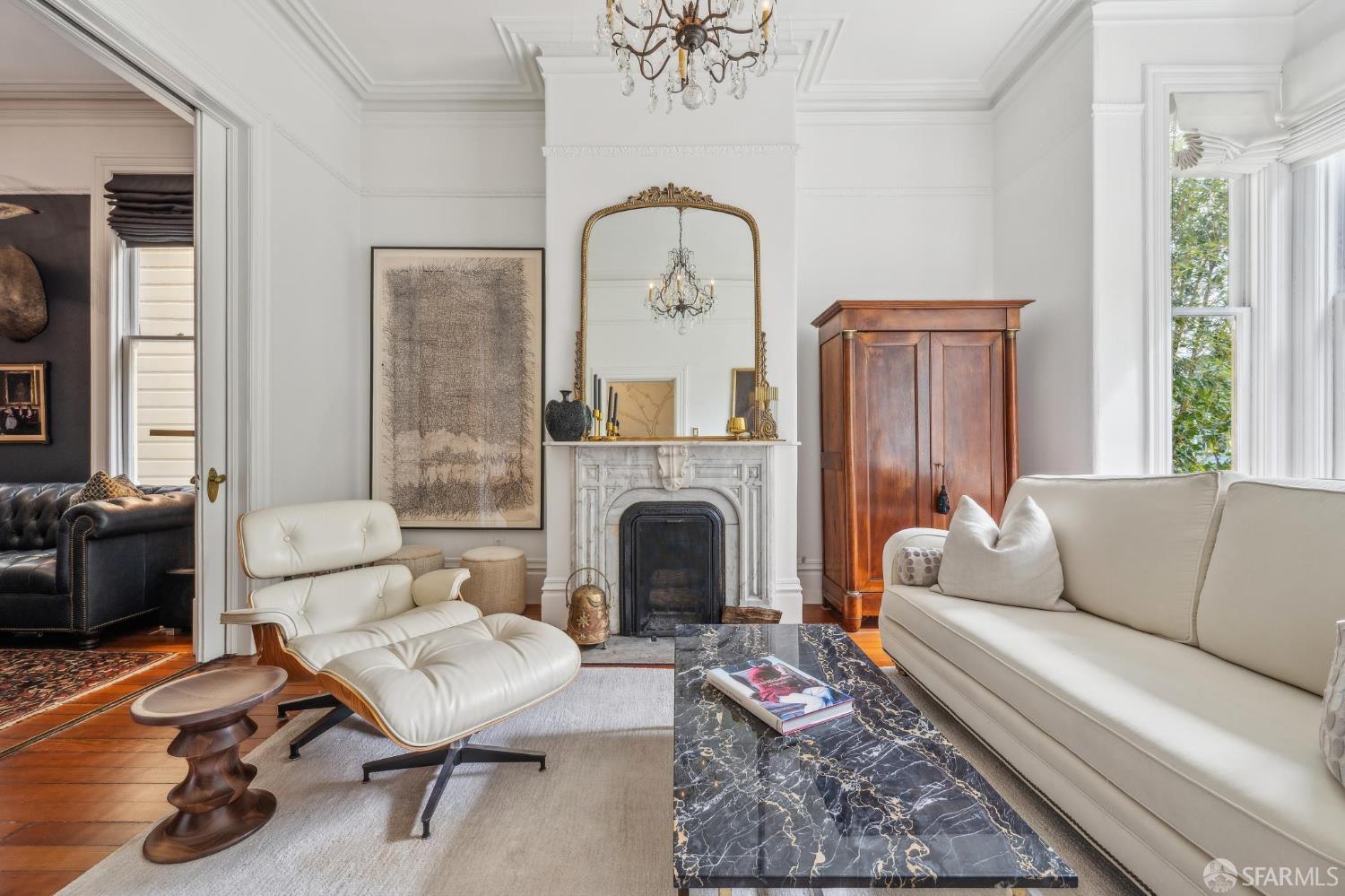 276 Page Street San Francisco, CA 94102 - Photo 2 of 25 a living room with furniture and a fireplace