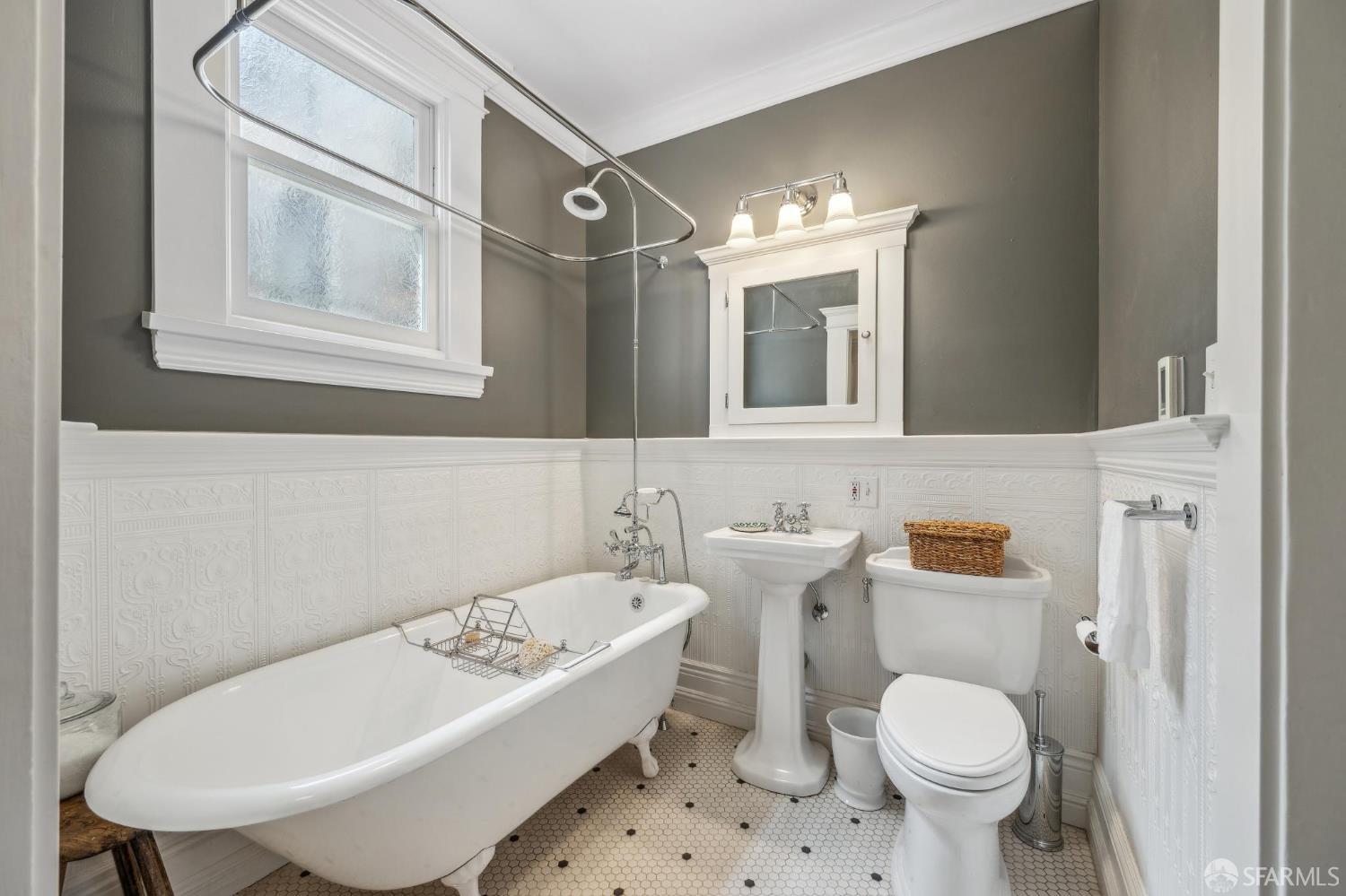 276 Page Street San Francisco, CA 94102 - Photo 24 of 25 a bathroom with a sink toilet and a mirror