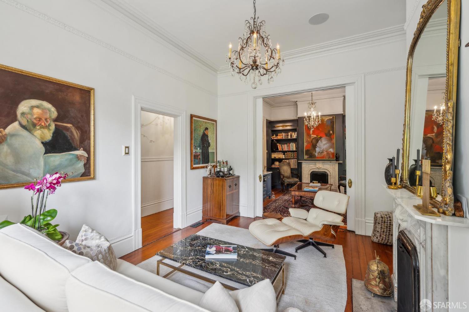 276 Page Street San Francisco, CA 94102 - Photo 5 of 25 a bedroom with a bed and chandelier