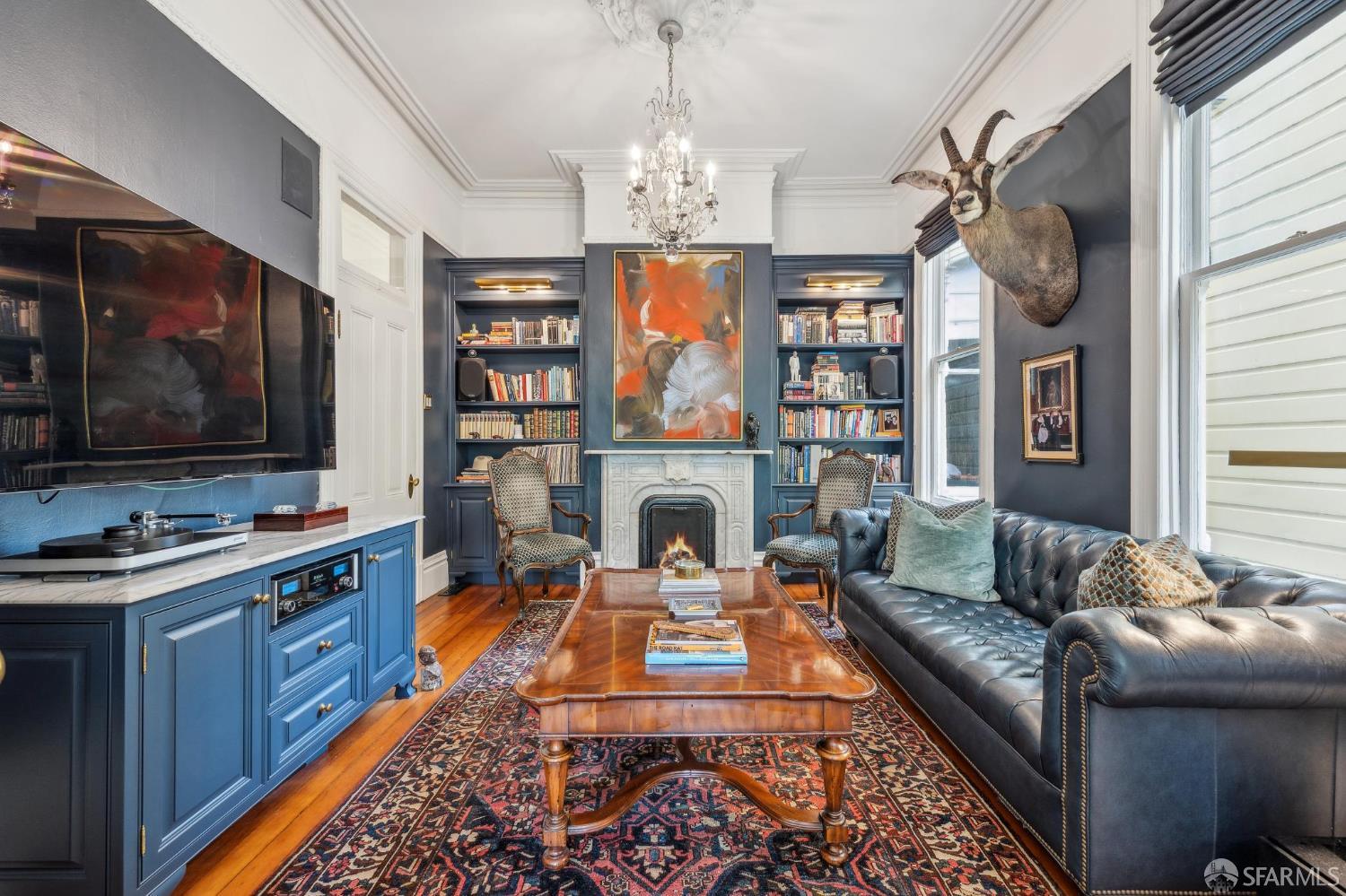 276 Page Street San Francisco, CA 94102 - Photo 6 of 25 a living room with fireplace furniture and a flat screen tv