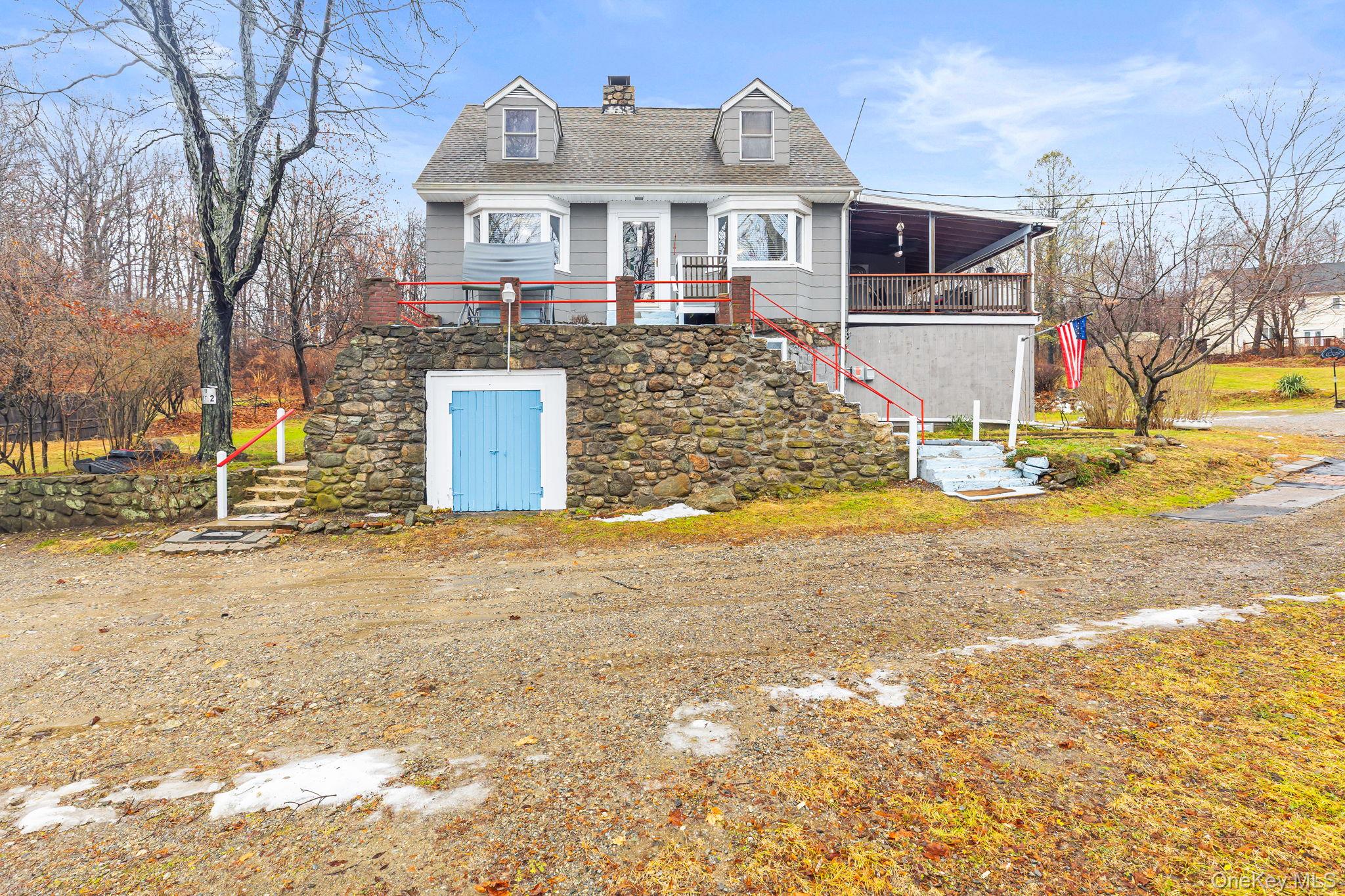 11 Cross Creek Road Cold Spring, NY 10516 - Photo 4 of 43 View of front of house with stairway, a chimney, and roof with shingles