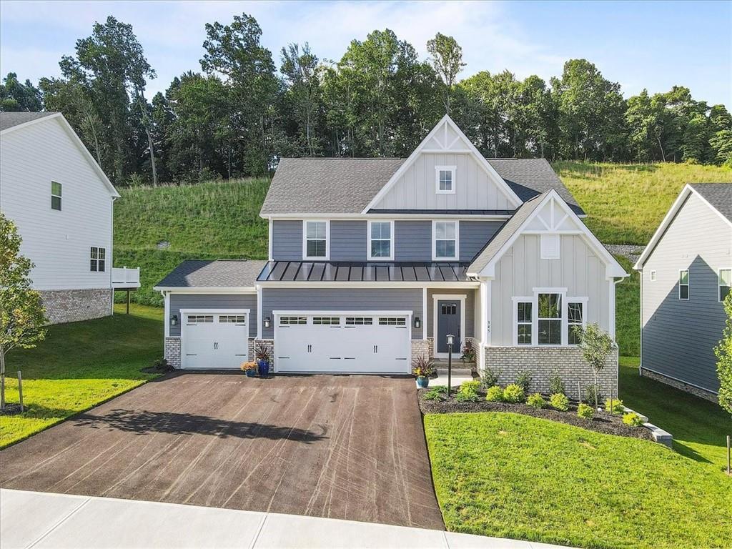 345 Crest Lane Mars, PA 16046 - Photo 1 of 42 a front view of a house with garden