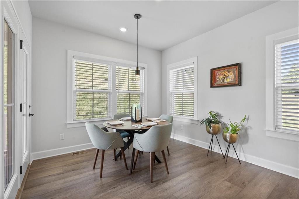345 Crest Lane Mars, PA 16046 - Photo 11 of 42 a view of a dining room with furniture window and wooden floor
