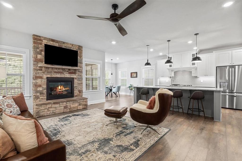 345 Crest Lane Mars, PA 16046 - Photo 13 of 42 a living room with furniture a flat screen tv and a fireplace