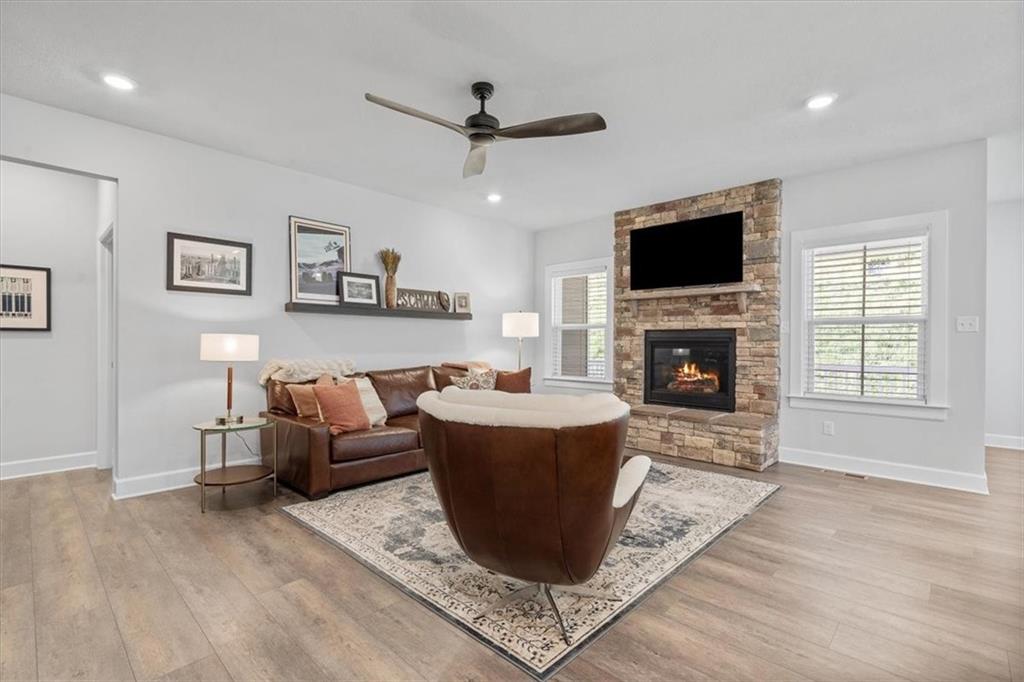345 Crest Lane Mars, PA 16046 - Photo 14 of 42 a living room with a couch a window and a fireplace