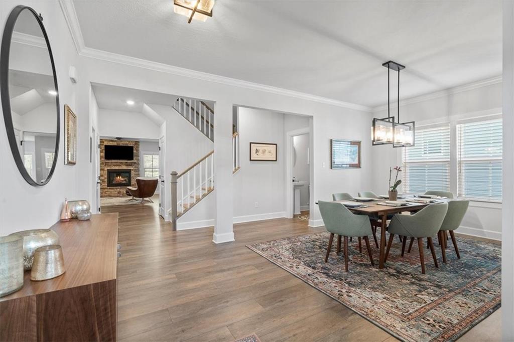 345 Crest Lane Mars, PA 16046 - Photo 17 of 42 a view of a dining room with furniture window and wooden floor