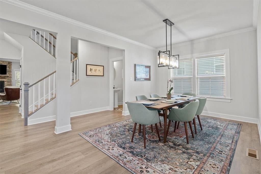 345 Crest Lane Mars, PA 16046 - Photo 18 of 42 a view of a dining room with furniture window and wooden floor