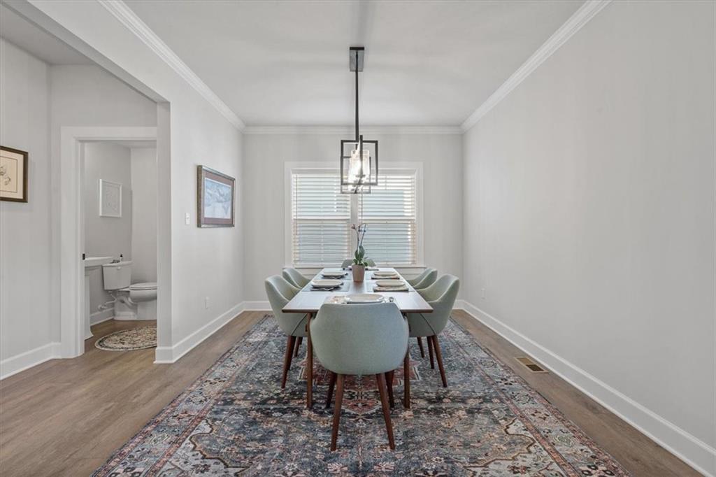 345 Crest Lane Mars, PA 16046 - Photo 19 of 42 a view of a dining room with furniture window and wooden floor