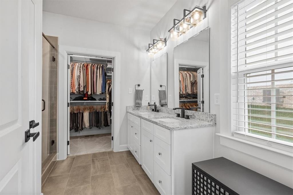 345 Crest Lane Mars, PA 16046 - Photo 24 of 42 a spacious bathroom with a double vanity sink a mirror and next to a window