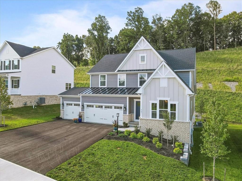 345 Crest Lane Mars, PA 16046 - Photo 3 of 42 a front view of a house with a yard