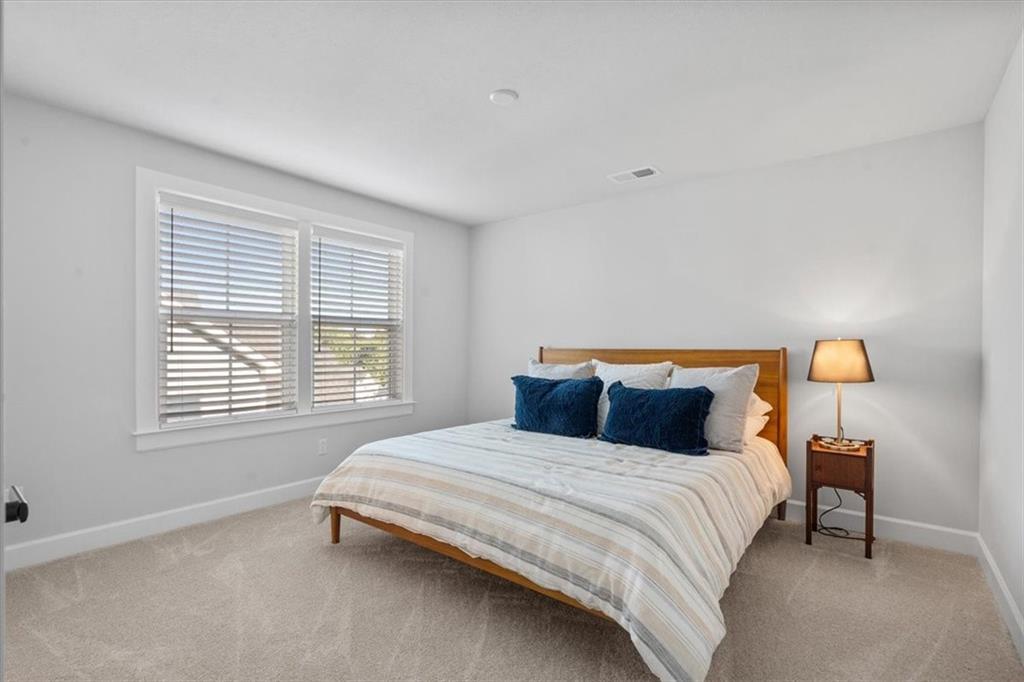 345 Crest Lane Mars, PA 16046 - Photo 31 of 42 a bedroom with a bed and a lamp